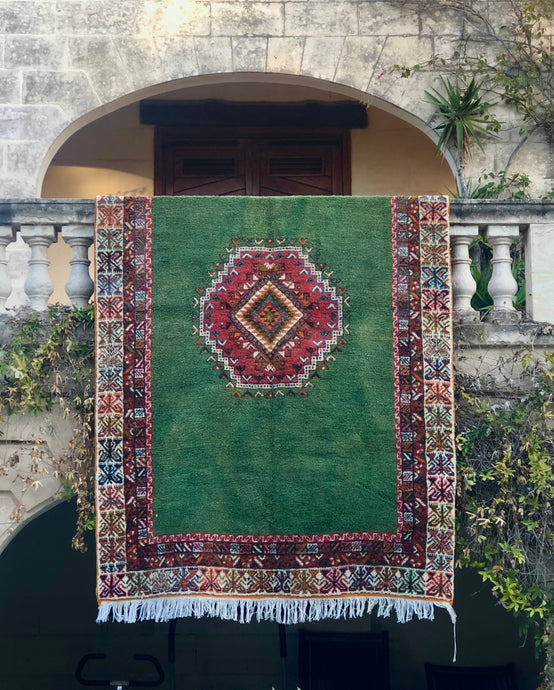 Middle Eastern Green pile rug